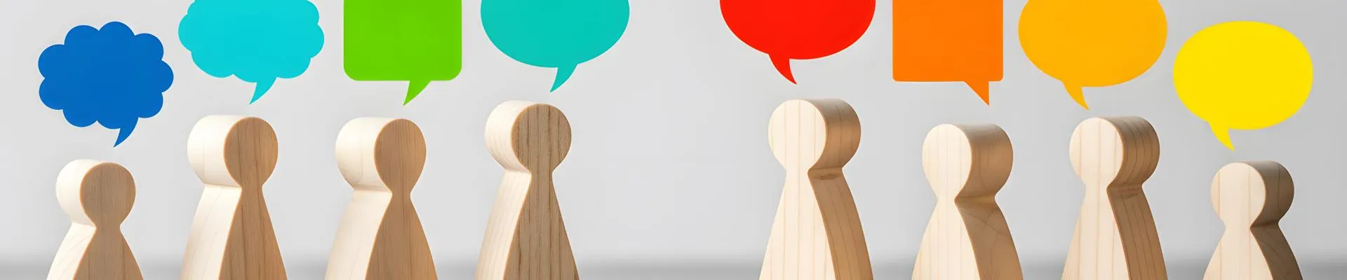 Wooden models with speech bubbles